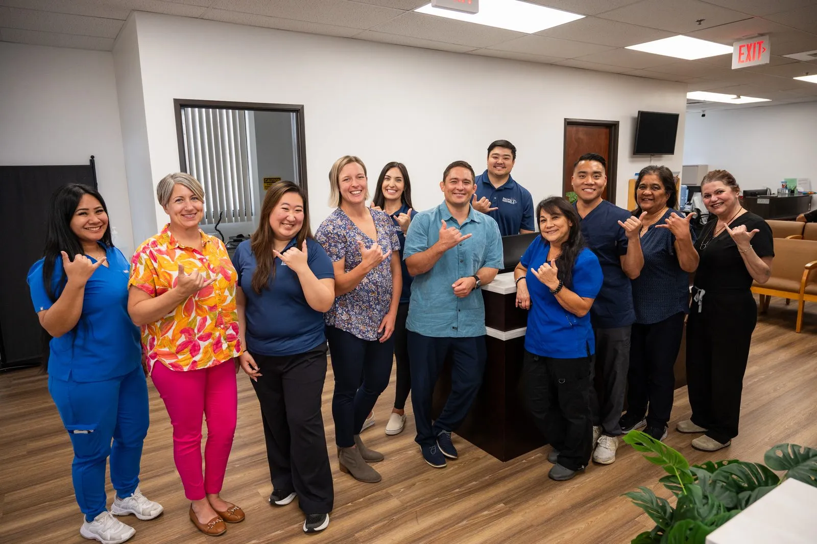 The Pacific Bone & Joint team throwing shakas together in Honolulu, Hawai‘i