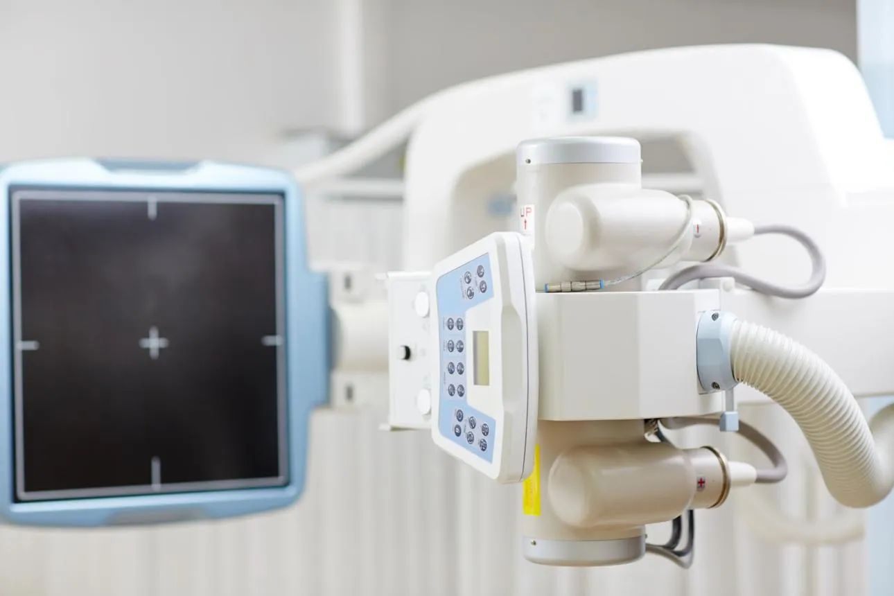 Close-up of a digital X-ray machine in a clinic imaging room